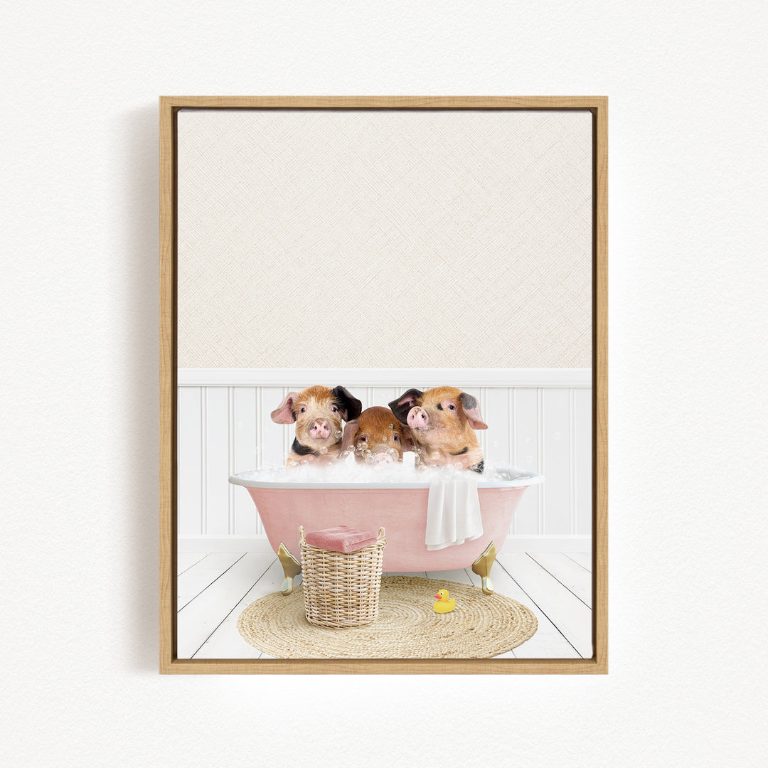 Three adorable pigs sitting in a pink bathtub, surrounded by a basket of toys and a yellow rubber duck.