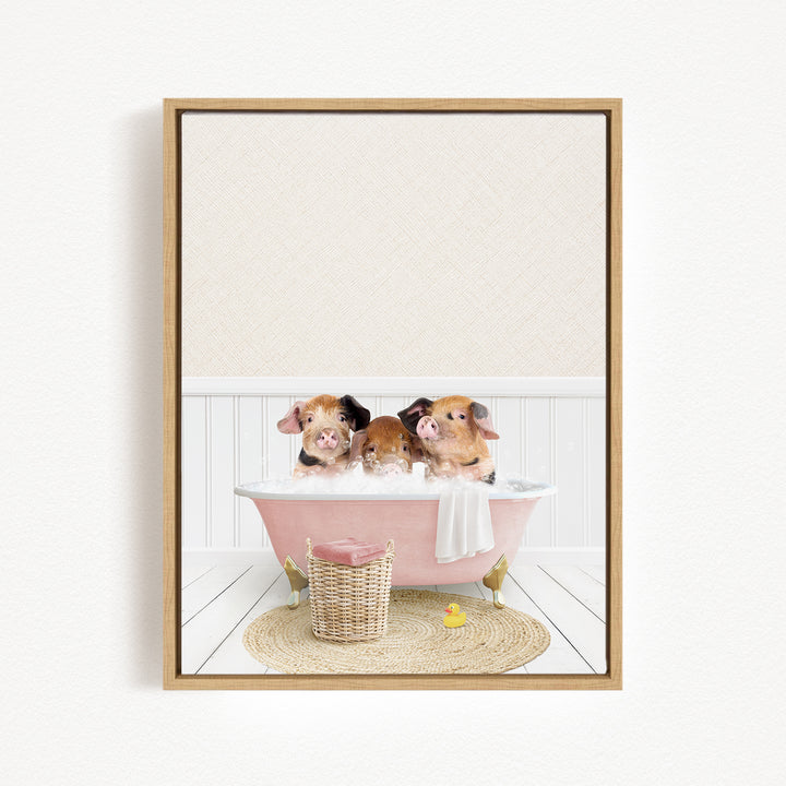 Three adorable pigs sitting in a pink bathtub, surrounded by a basket of toys and a yellow rubber duck.