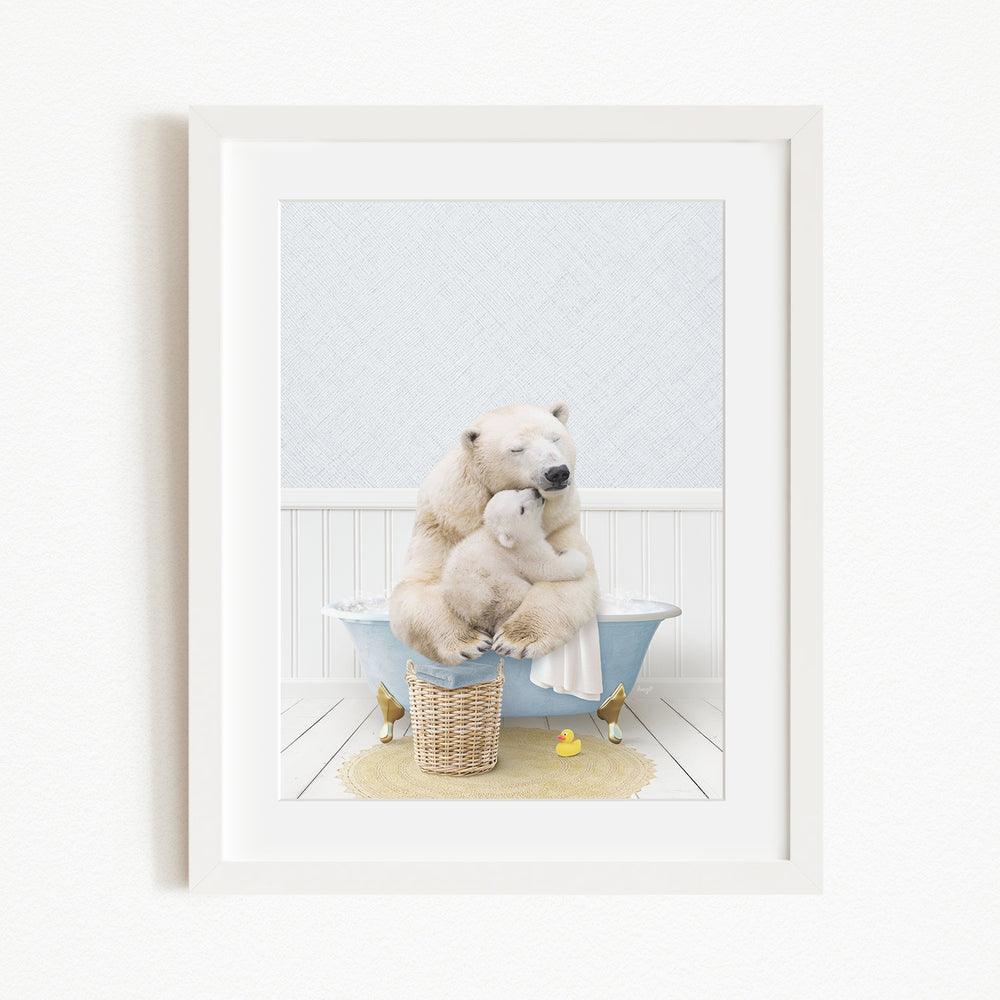 A framed image depicting a mother polar bear sitting in a bathtub, holding her cub, with a yellow rubber duck nearby.