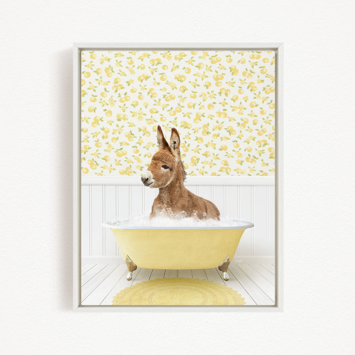 A donkey is sitting in a yellow bathtub filled with water, surrounded by a yellow floral pattern on the wall behind it.