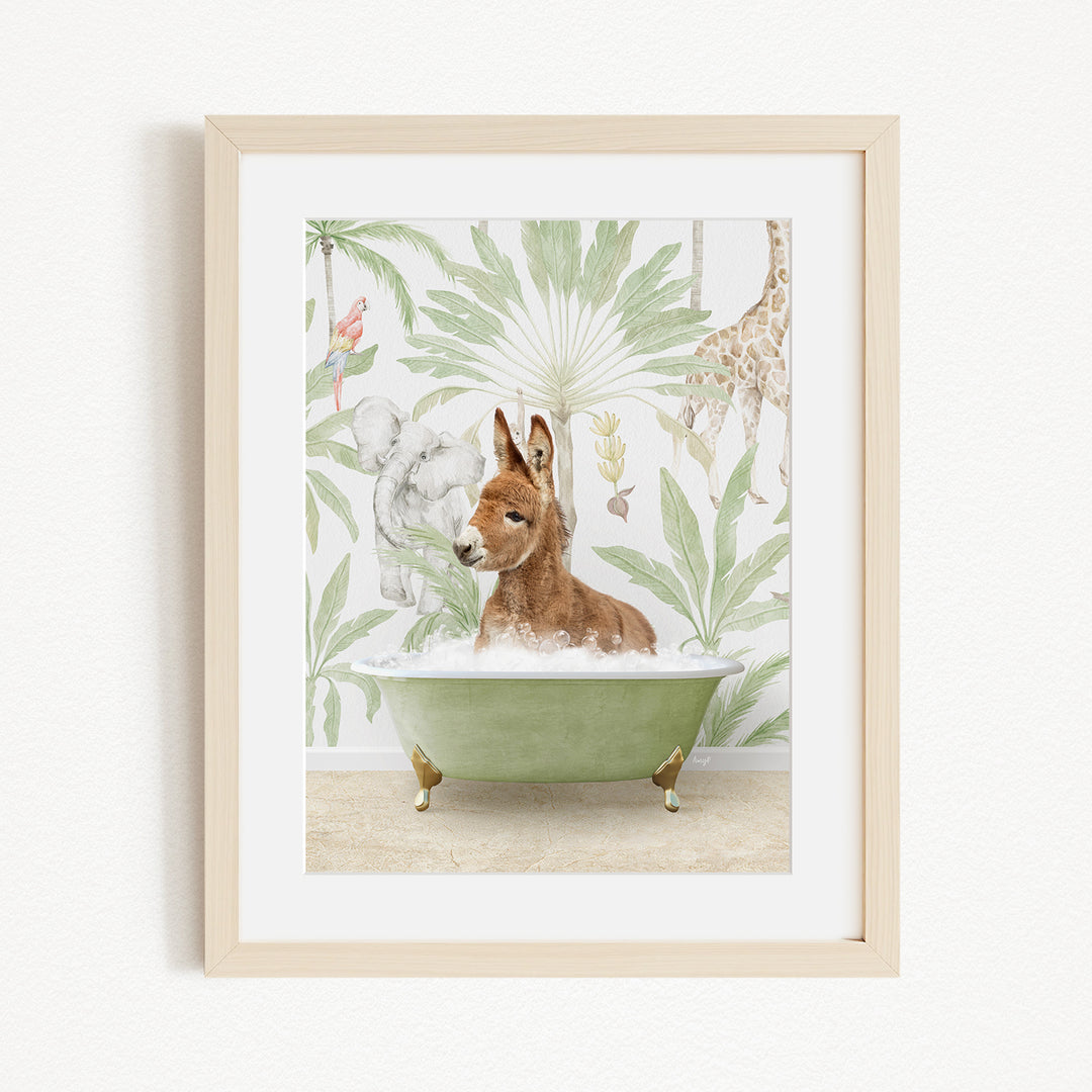 A framed print depicting a donkey sitting in a green bathtub, surrounded by various animals and plants, including a giraffe and a kangaroo.