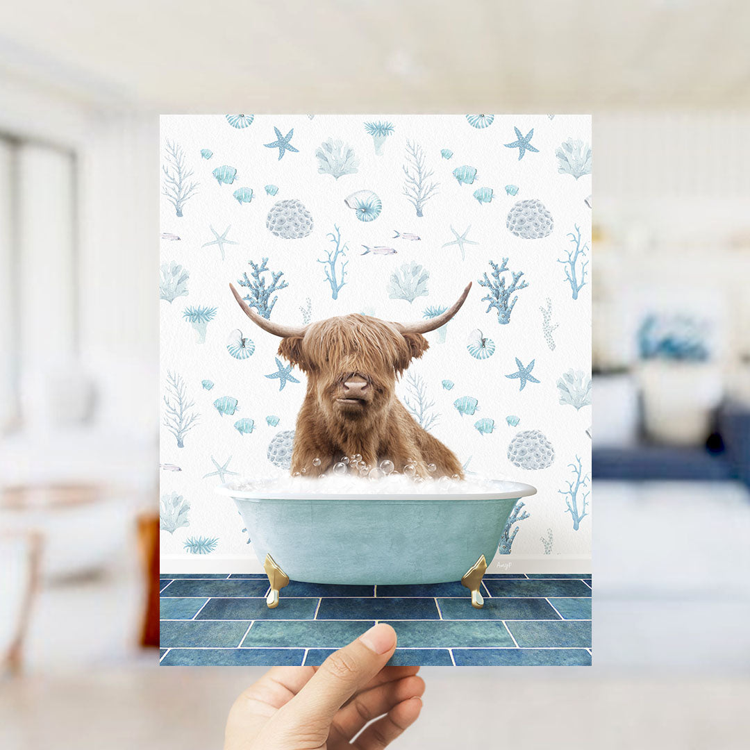 A brown cow with horns is sitting in a blue bathtub filled with bubbles, surrounded by a pattern of blue and white seashells and starfish.