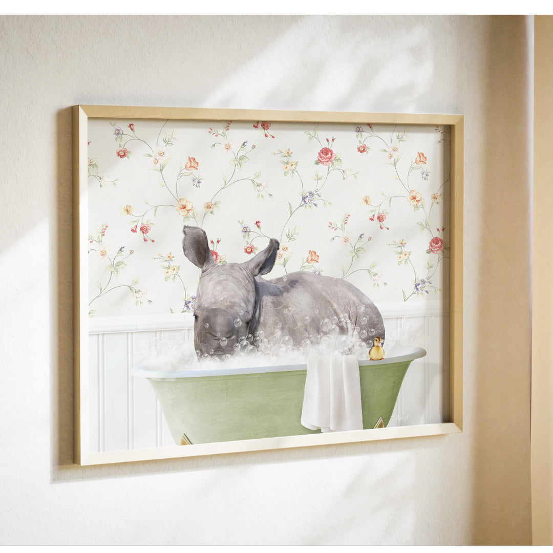 A rhinoceros is sitting in a green bathtub filled with bubbles, surrounded by a floral wallpaper.