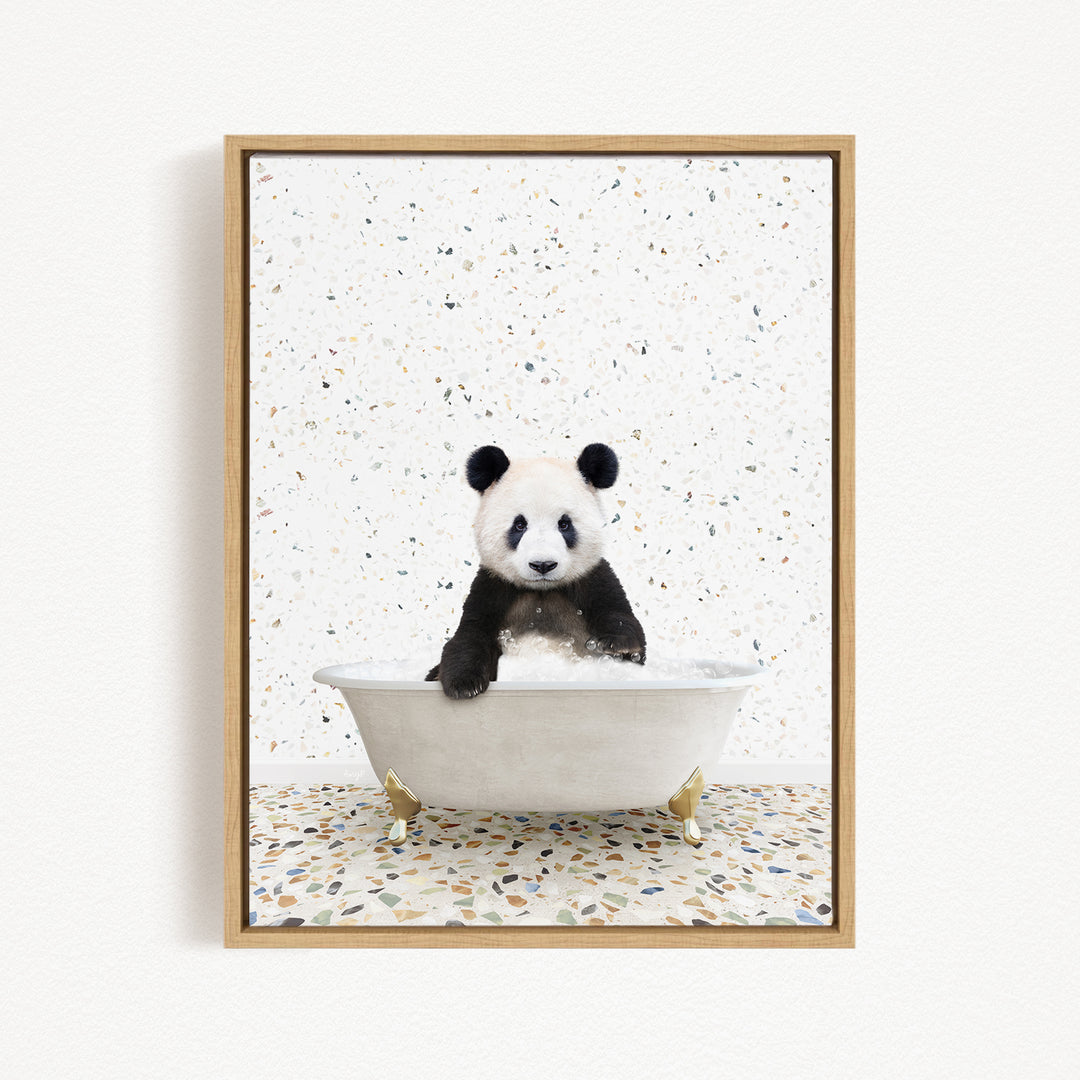 A panda bear sitting in a white bathtub against a speckled white background.