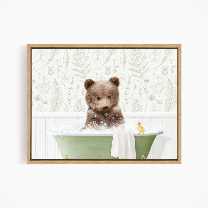 A brown bear sitting in a green bathtub, surrounded by a yellow duck and a white towel, against a backdrop of green ferns and other plants.