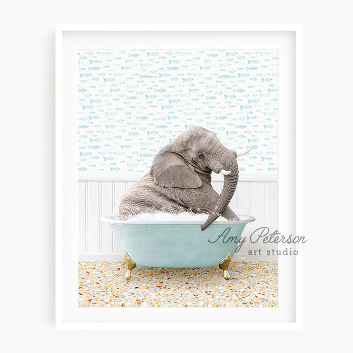 a baby elephant sitting in a bath tub