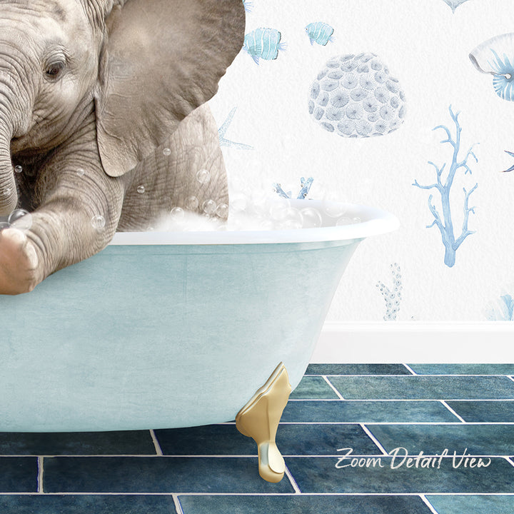 A baby elephant sitting in a bathtub filled with bubbles, surrounded by a blue and white ocean-themed wallpaper.