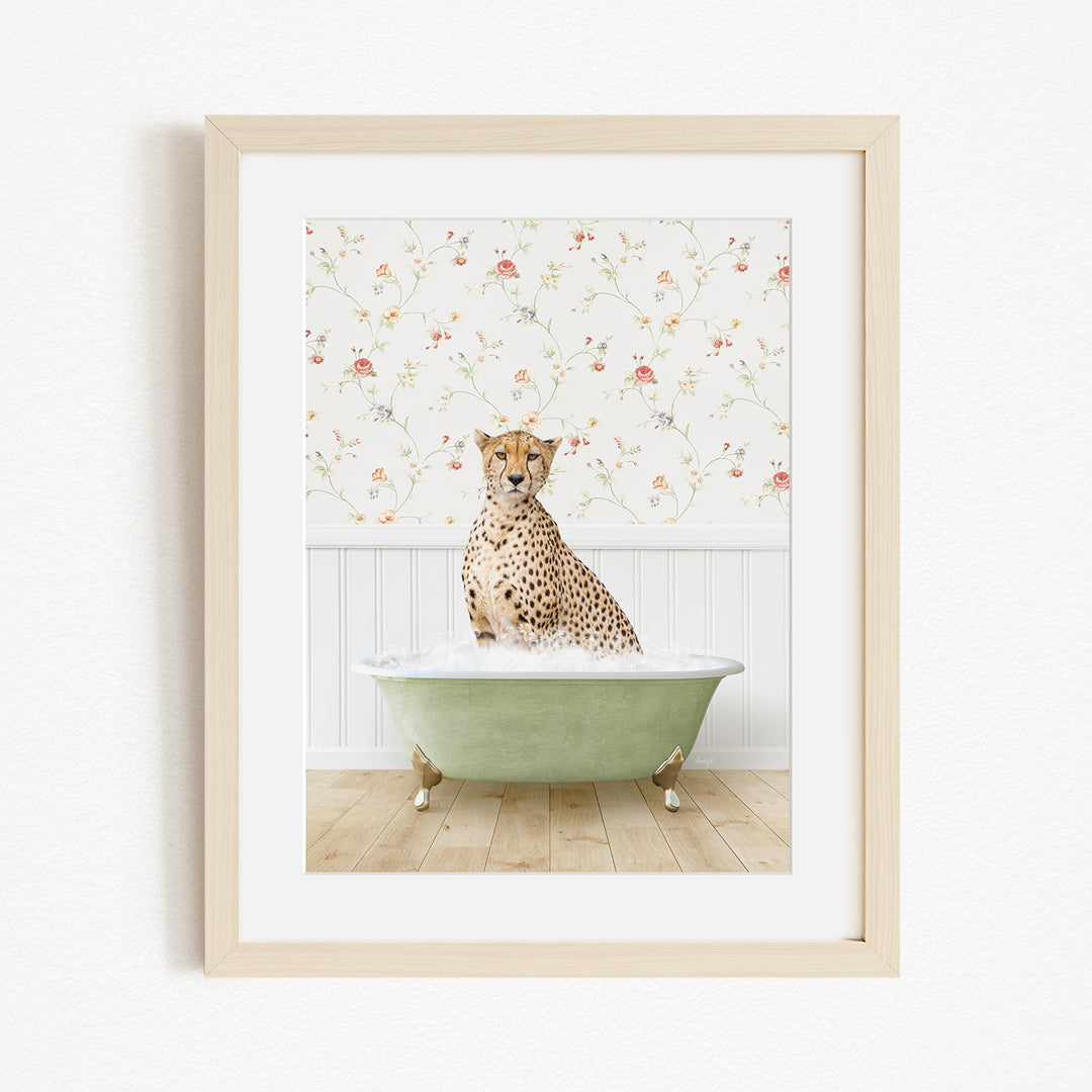 A cheetah sitting in a green bathtub filled with water, with a floral wallpaper in the background.