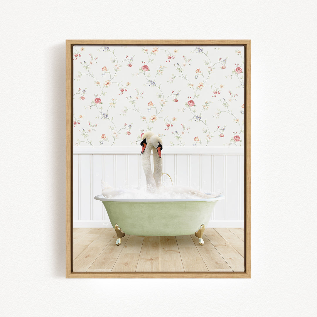 A framed image depicting a swan standing in a green bathtub filled with bubbles, with a floral wallpaper in the background.