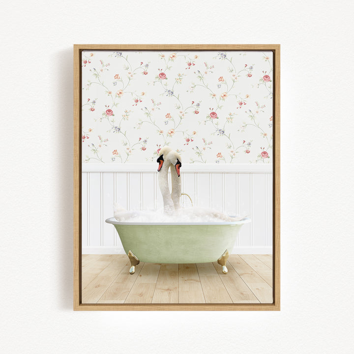 A framed image depicting a swan standing in a green bathtub filled with bubbles, with a floral wallpaper in the background.