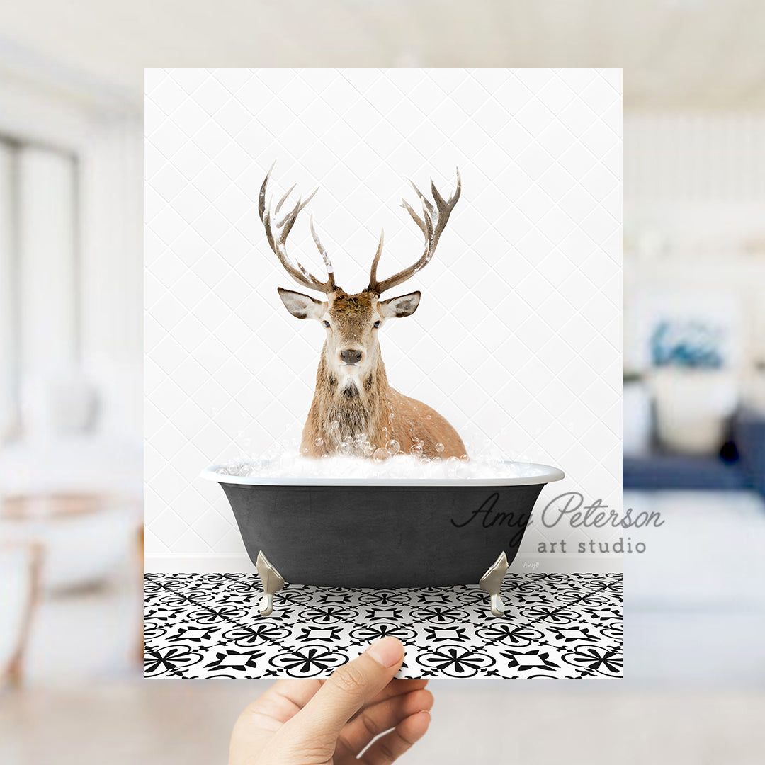 a hand holding up a card with a picture of a deer in a bathtub