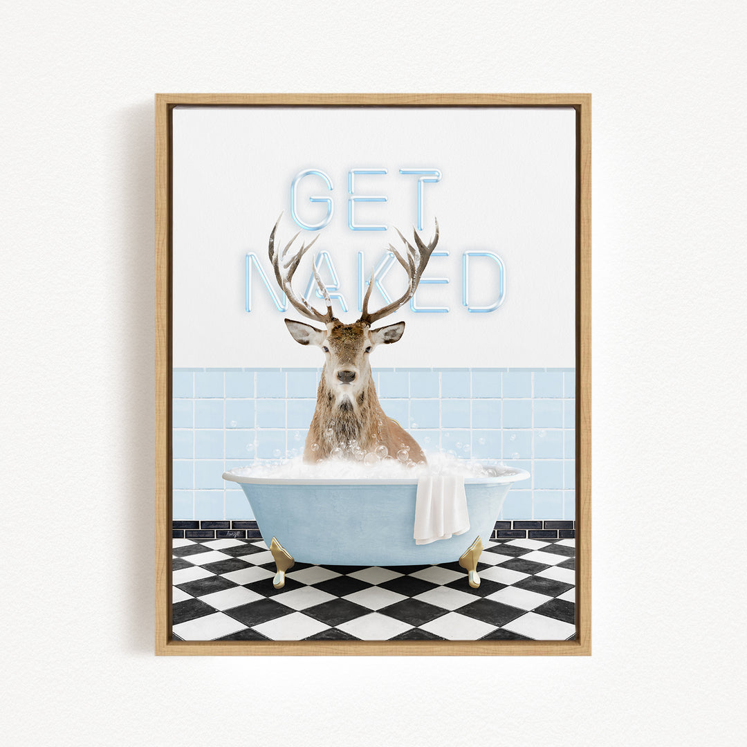 A deer with antlers is sitting in a bathtub filled with bubbles, with the words "GET NAKED" written on the wall behind it.