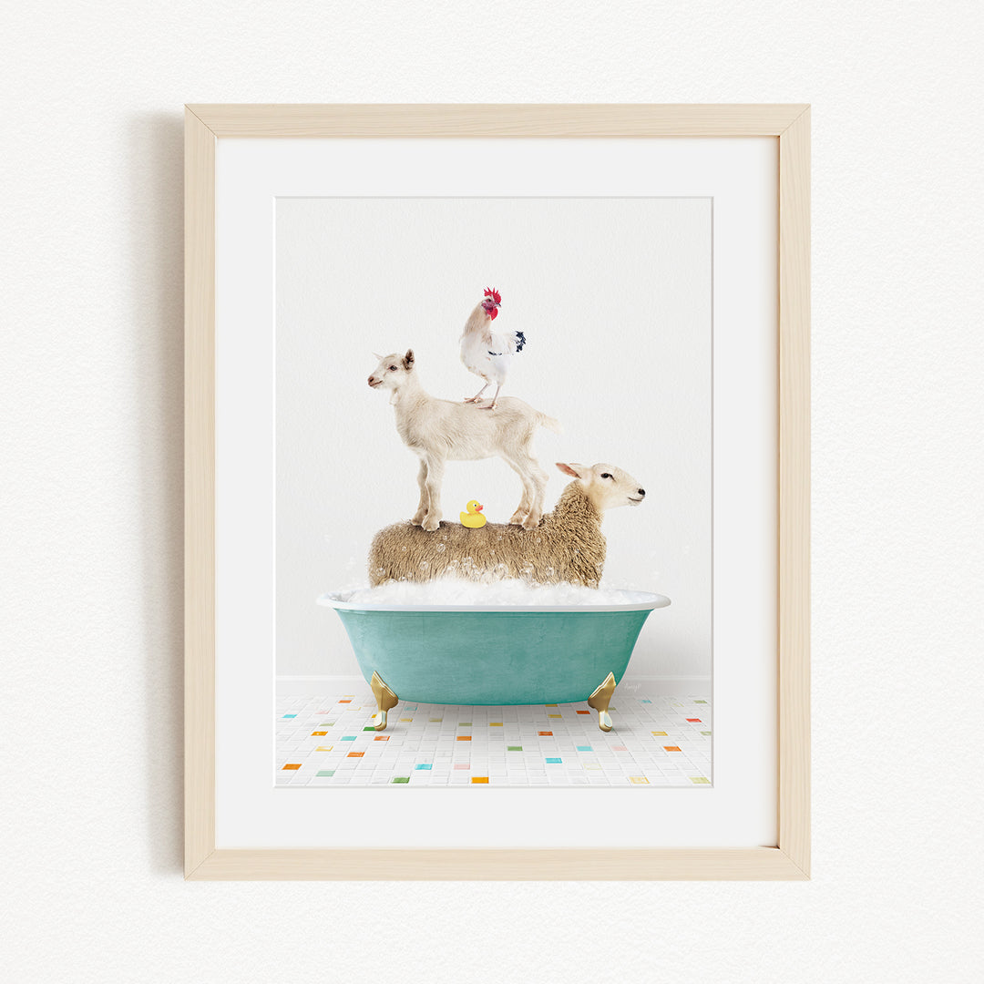 A framed image depicting a sheep standing on a tub filled with bubbles, with a chicken perched on top and a duck sitting on the sheep's back.