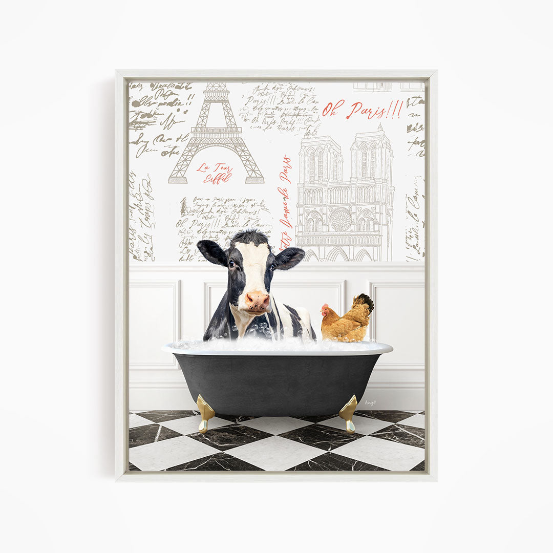A cow is sitting in a bathtub filled with water, with a chicken nearby, in a room with a Paris-themed wallpaper.