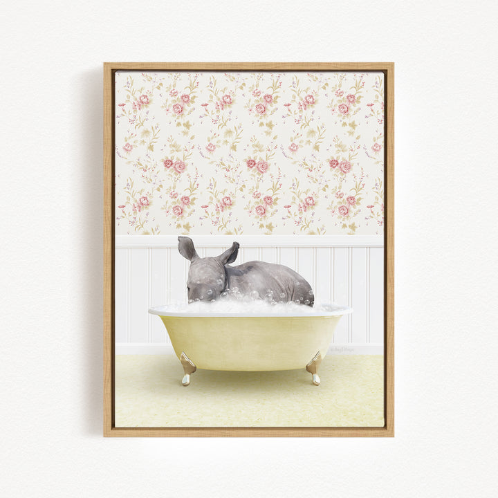 A gray rhinoceros is sitting in a yellow bathtub, surrounded by a floral wallpaper.