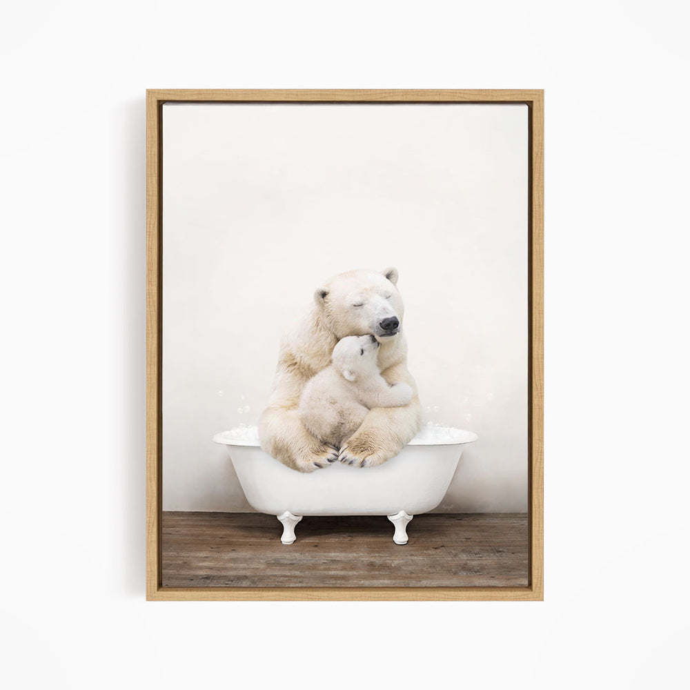 A mother polar bear and her cub sitting together in a white bathtub.