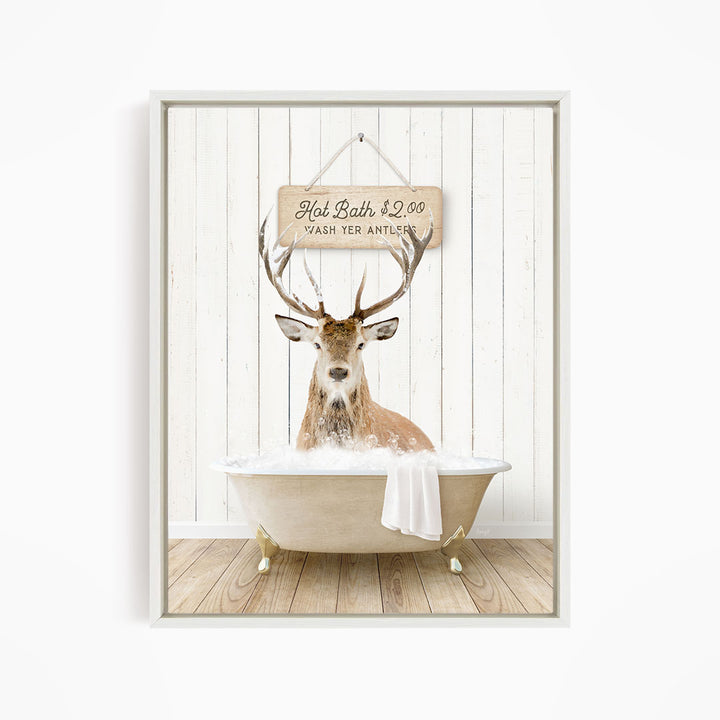 A deer with antlers is sitting in a bathtub, with a sign above it that reads "Hot Bath $2.00 WASH YER ANTLES".
