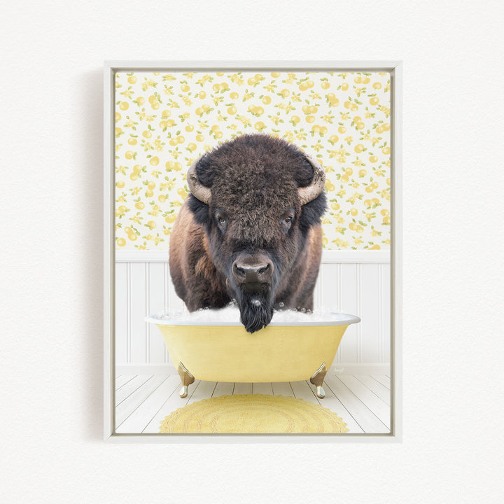 A buffalo with a long beard is sitting in a yellow bathtub, surrounded by a yellow floral pattern on the wall behind it.
