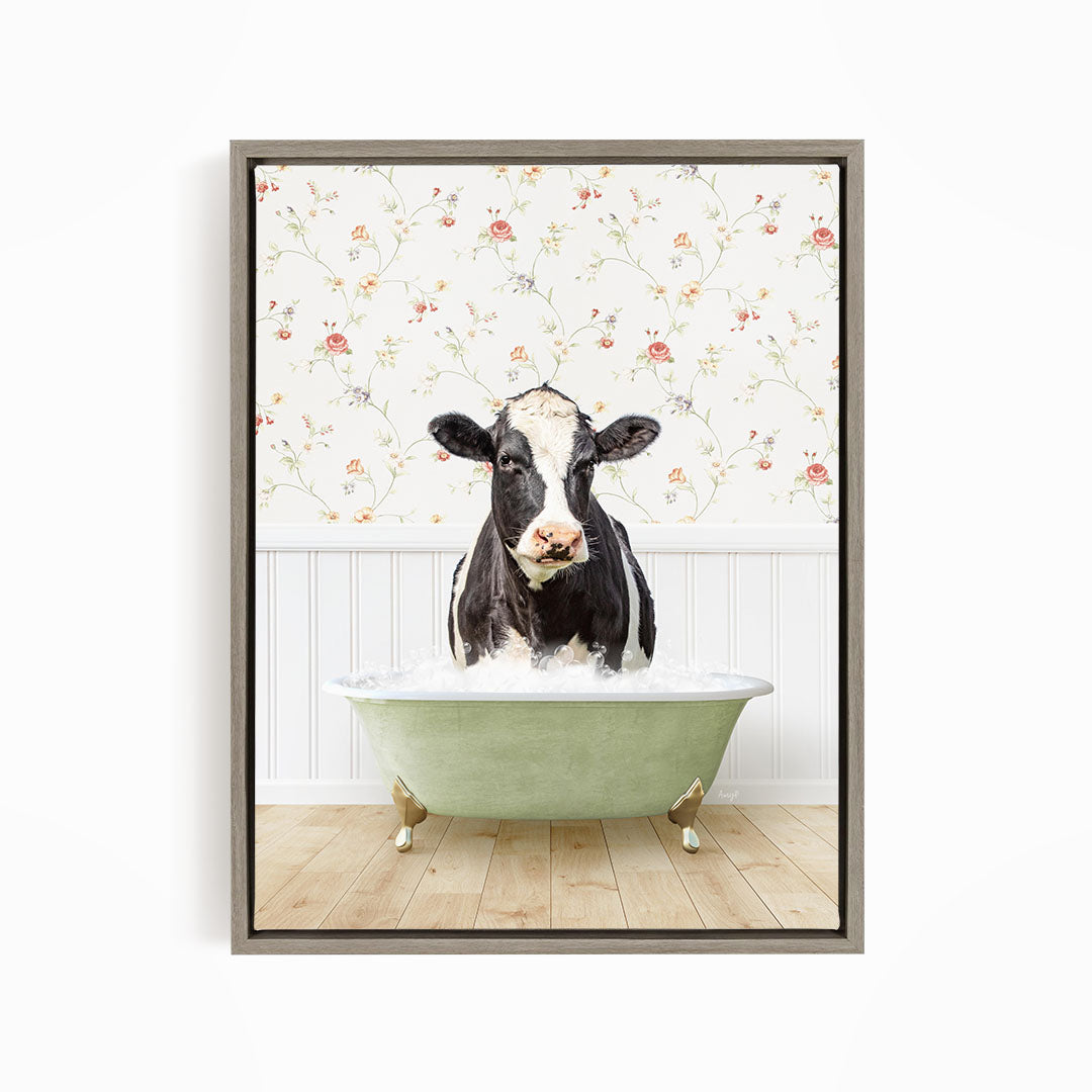A black and white cow is standing in a green bathtub filled with water, creating a whimsical and humorous scene.