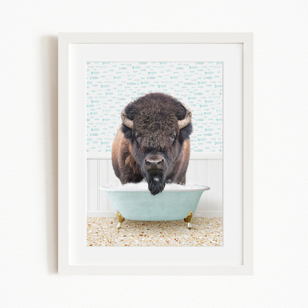 A buffalo standing in a bathtub filled with water, with a patterned wall behind it.
