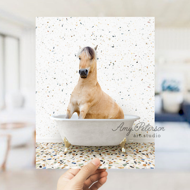 a person holding a card with a horse in a bathtub