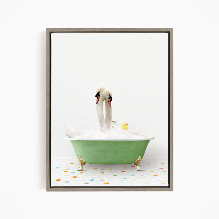A pair of swans sitting in a green bathtub filled with bubbles, with a yellow rubber duck floating nearby.