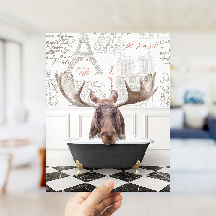 A moose is sitting in a bathtub filled with water, surrounded by various Paris-themed elements such as the Eiffel Tower and text.