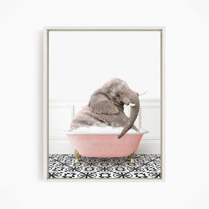 A gray elephant is sitting in a pink bathtub filled with bubbles, surrounded by a black and white patterned floor.