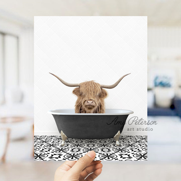 a hand holding up a card with a picture of a bull in a bathtub