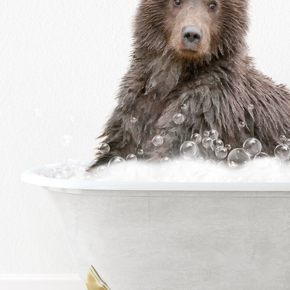 a brown bear sitting in a bathtub filled with bubbles