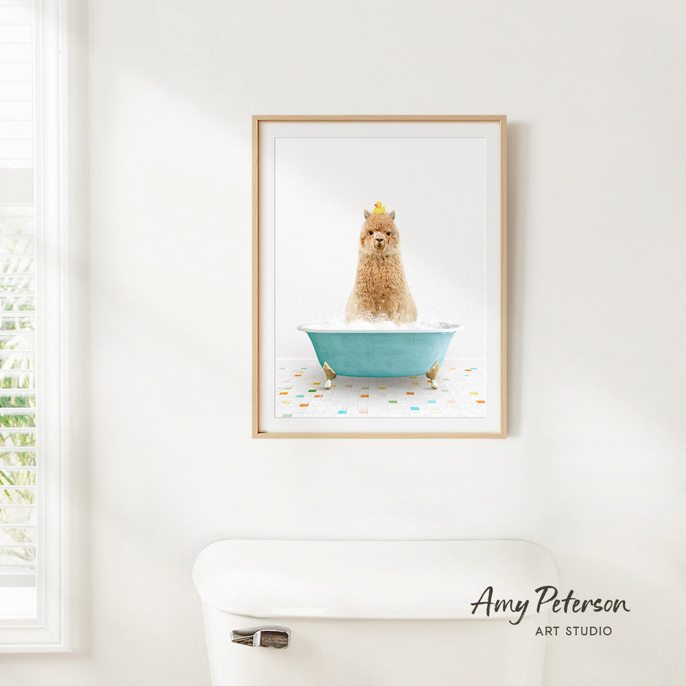 A framed image of a dog sitting in a bathtub, with a yellow crown on its head, is hanging on a white wall.