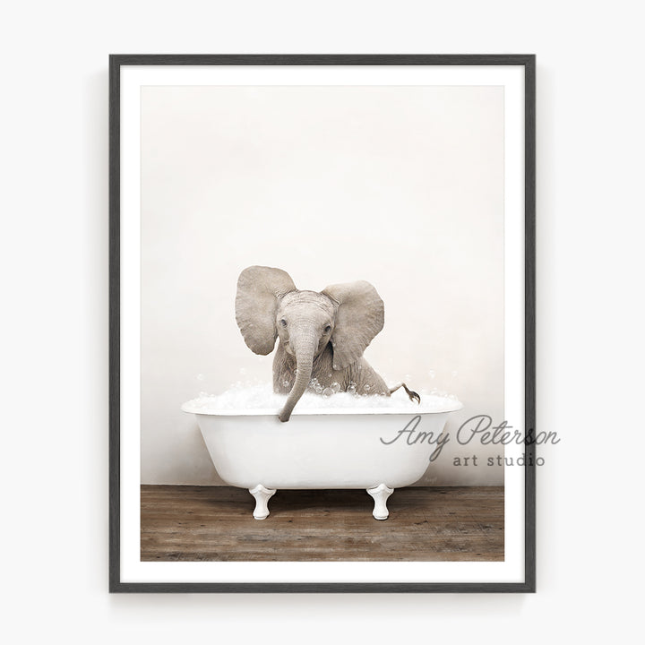 an elephant taking a bath in a bathtub