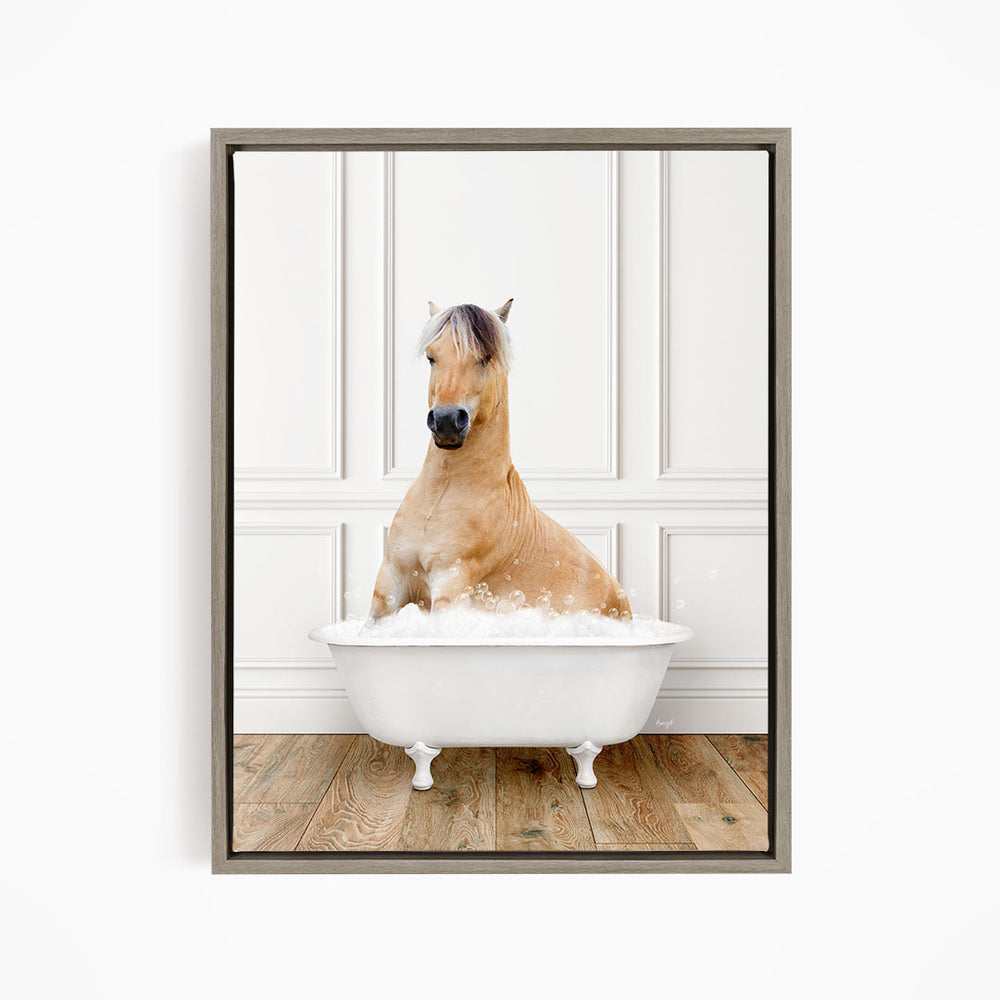 A brown horse sitting in a white bathtub filled with water, with a wooden floor in the background.