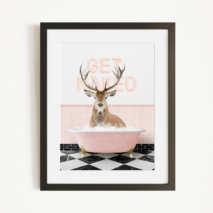 A deer with antlers is sitting in a pink bathtub, with a pink and white checkered floor and a pink and white wall behind it.