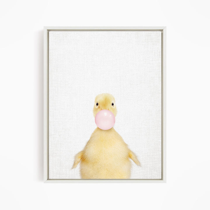 A cute yellow duck blowing a bubble with a pink bubble gum bubble.