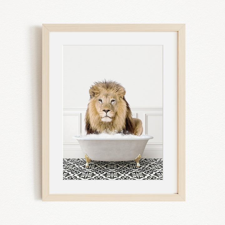 A lion sitting in a white bathtub filled with bubbles, surrounded by a black and white patterned floor.