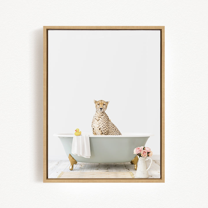 A cheetah sits in a bathtub filled with water, surrounded by a yellow rubber duck and pink flowers.