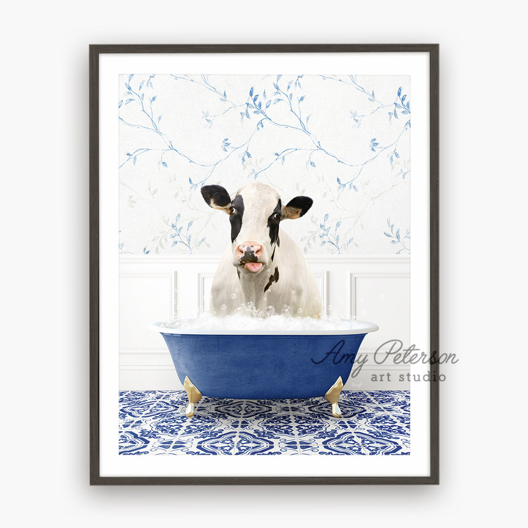 a cow is sitting in a blue bathtub