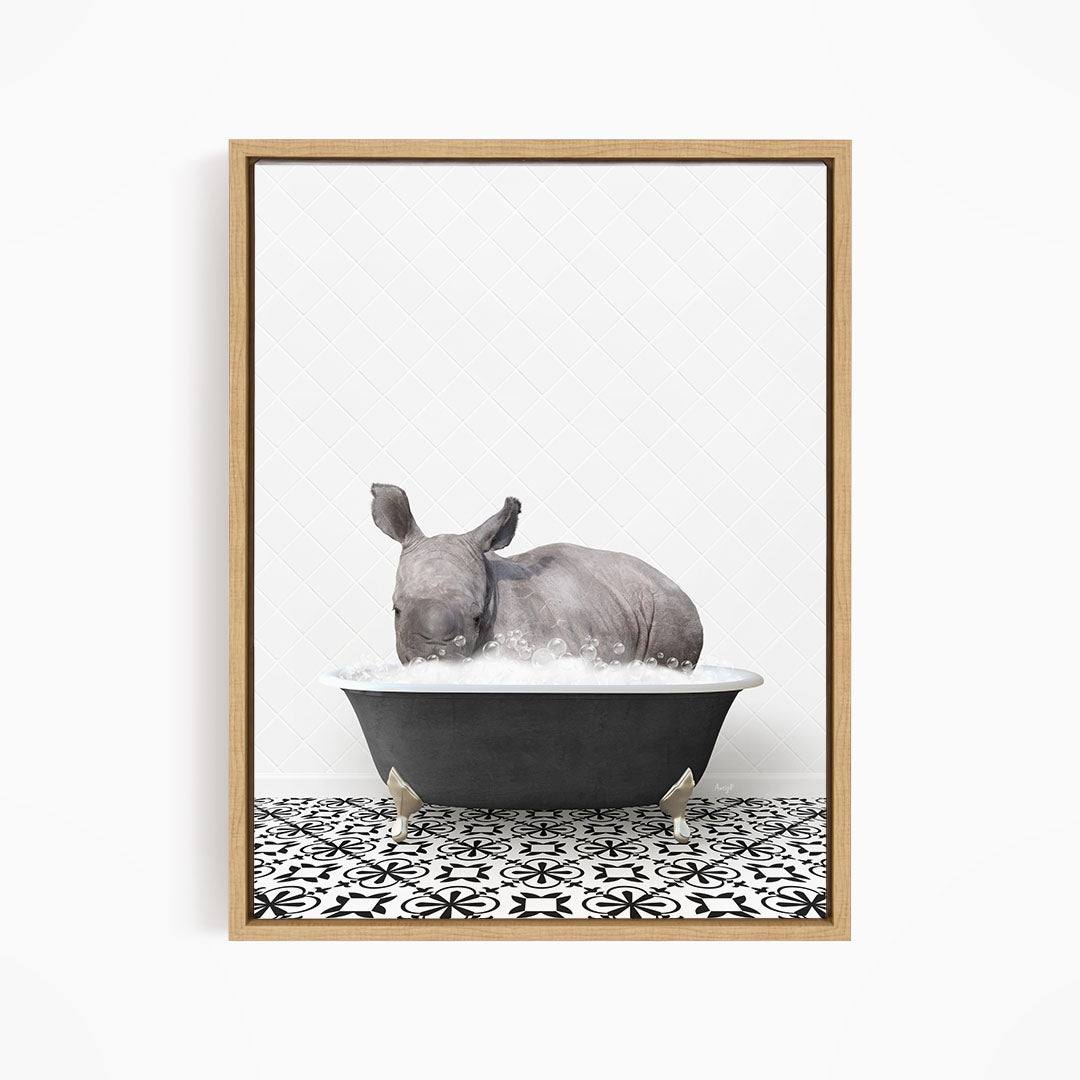 A rhinoceros is sitting in a bathtub filled with water, creating a whimsical and playful scene.