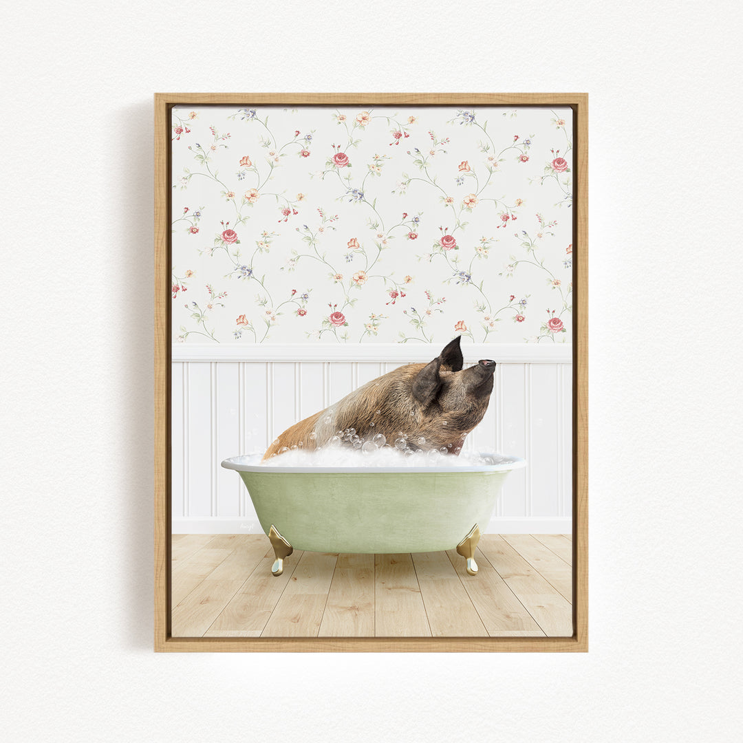 A brown pig sitting in a green bathtub filled with water, with a floral wallpaper in the background.