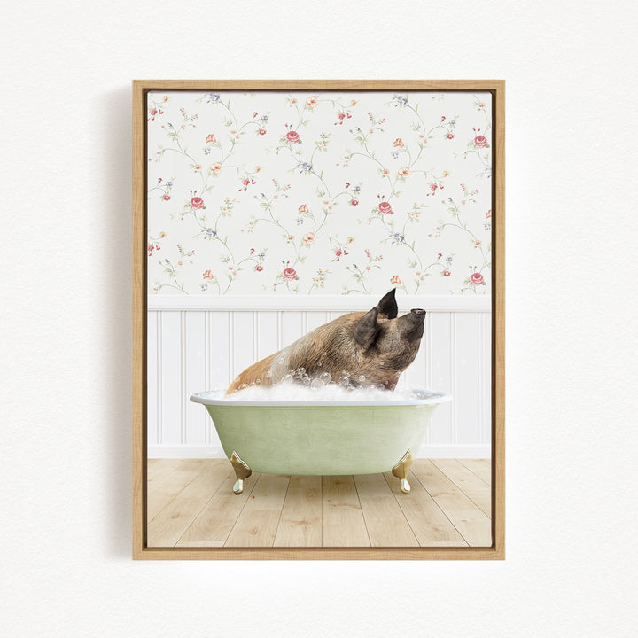 A brown pig sitting in a green bathtub filled with water, with a floral wallpaper in the background.