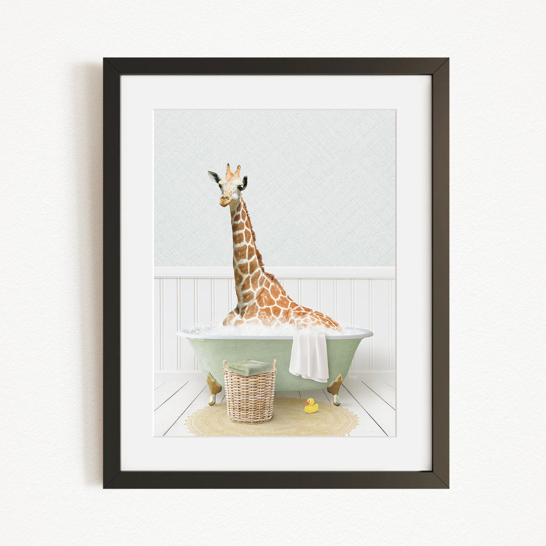 A giraffe sitting in a green bathtub filled with bubbles, surrounded by a basket of rubber ducks and a towel.