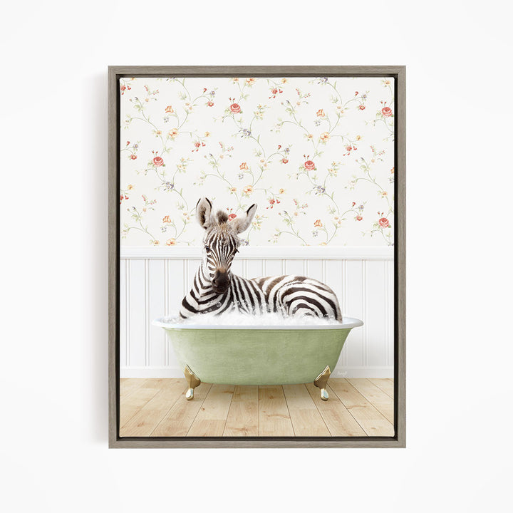 A zebra is sitting in a green bathtub, surrounded by a floral wallpaper.