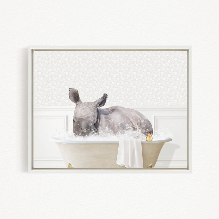 A rhinoceros is sitting in a bathtub filled with water, surrounded by bubbles, creating a whimsical and playful scene.