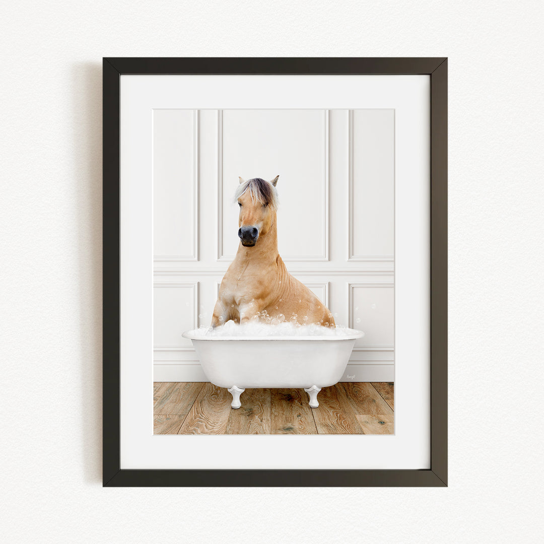 A light brown horse is sitting in a white bathtub filled with water, creating a whimsical and playful scene.