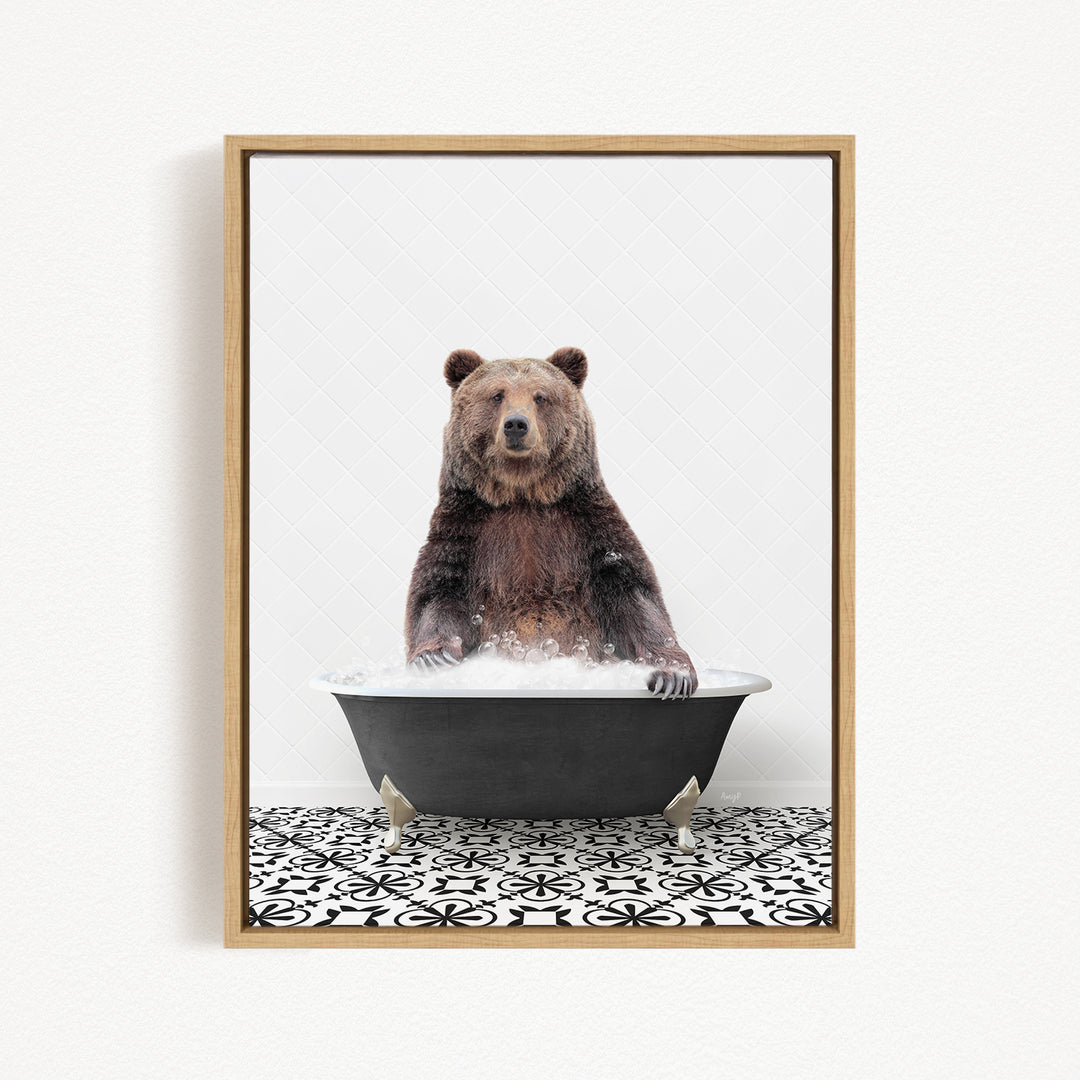 A brown bear sitting in a black bathtub filled with water, surrounded by a black and white patterned floor.