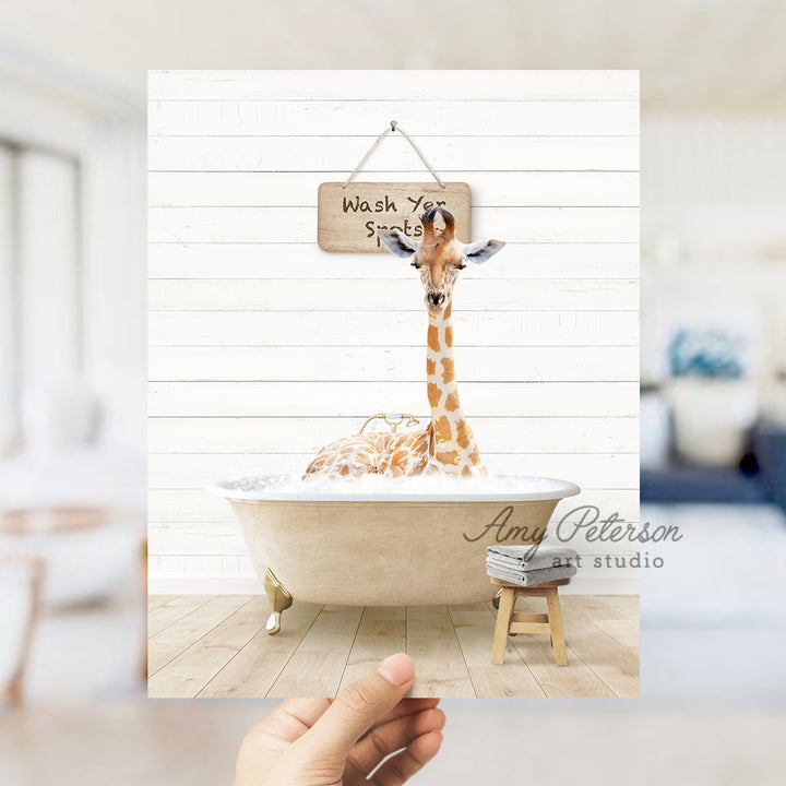 a giraffe in a bathtub with a sign hanging from it's