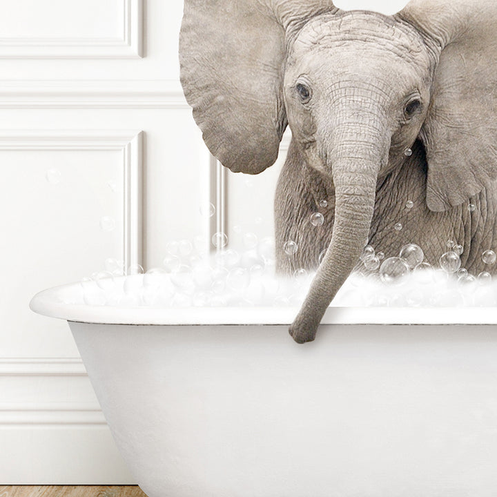 an elephant is taking a bath in a bathtub