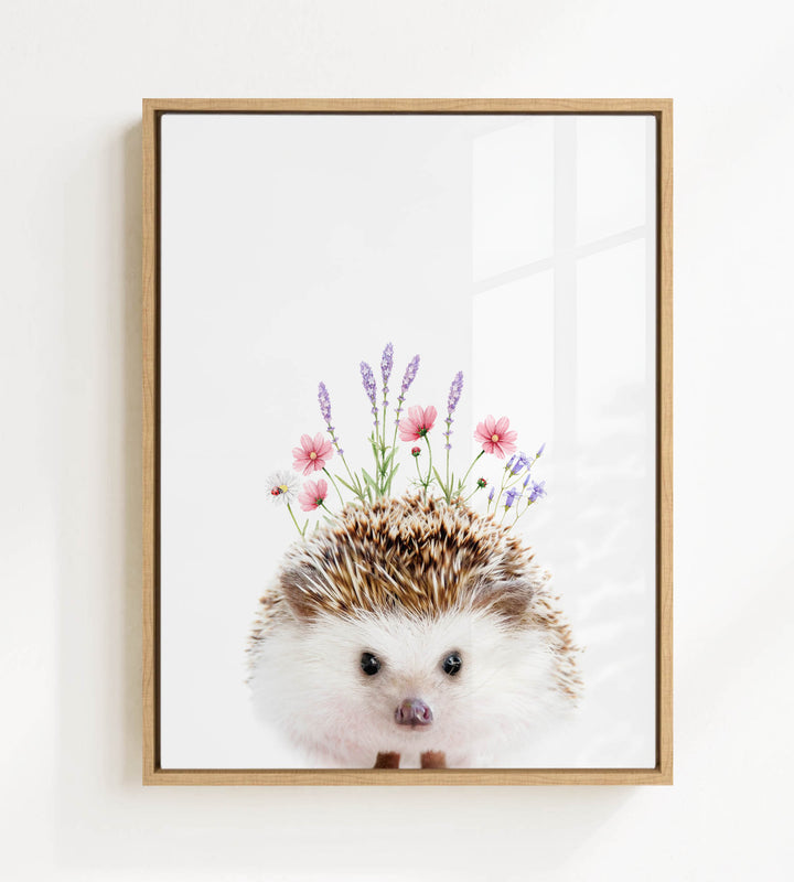 A framed print of a hedgehog with flowers on its head.