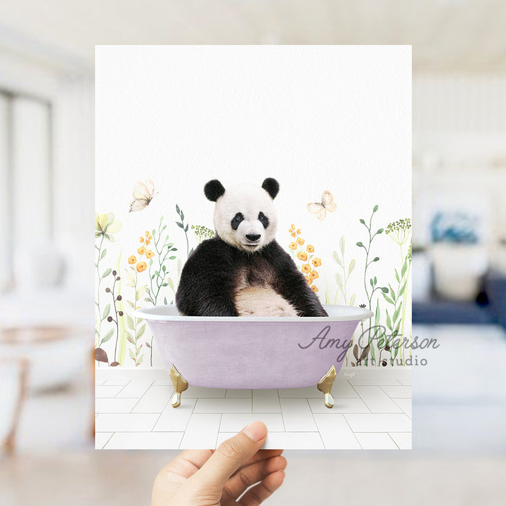 a panda bear sitting in a bath tub